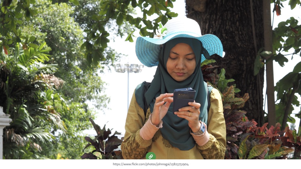 a woman using smartphone