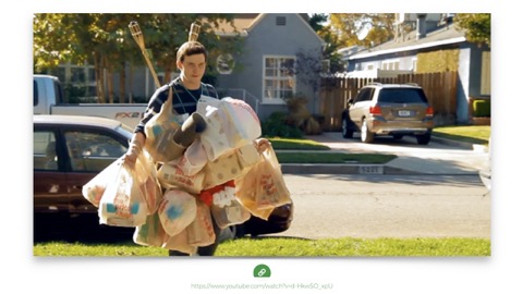 man carrying way too many groceries